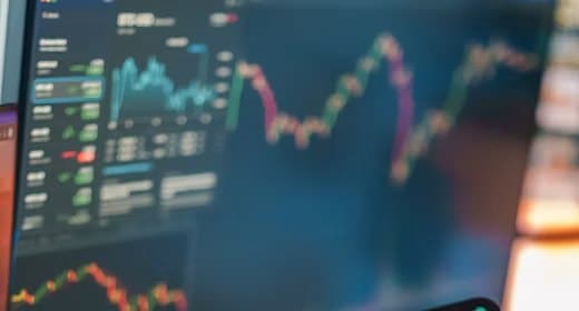 Trading screens showing market charts